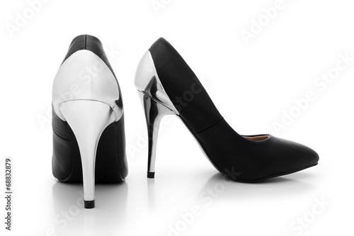 Sexy black shoes with silver high heels on white