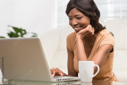 portrait of attractive businesswoman working on laptop.