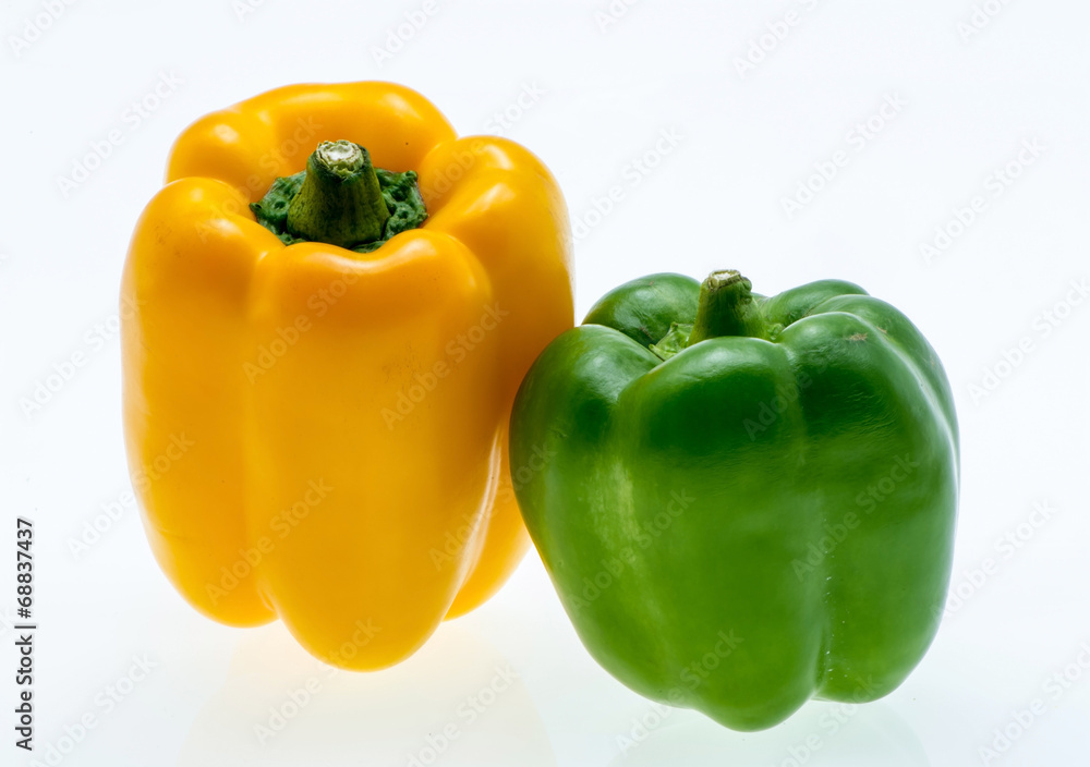 Orange and green bell peppers. on white background Orange and green bell peppers. on white background