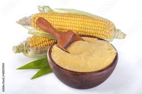 corn with grits polenta in a wooden bowl on white
