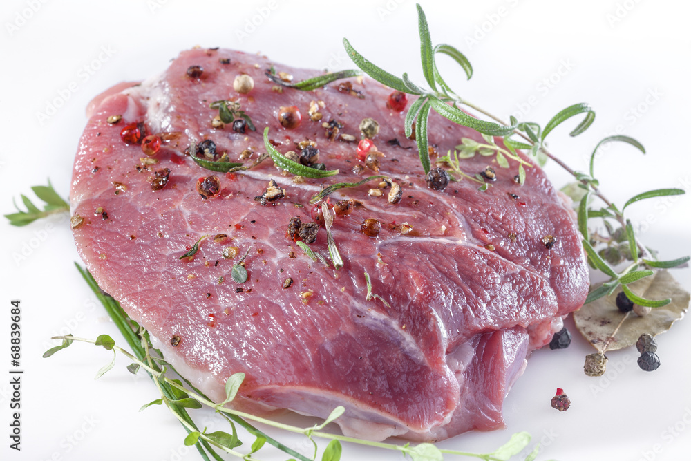 Fresh meat with pepper, mint, rosemary, thyme and spices Fresh meat with pepper, mint, rosemary, thyme and spices
