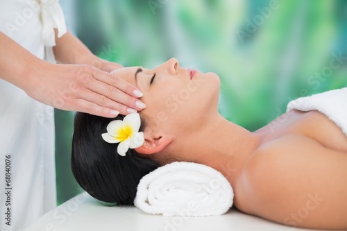 Beautiful brunette enjoying a head massage