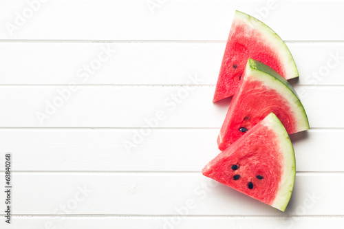 sliced watermelon on kitchen table