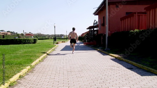 Wallpaper Mural Muscular man jogging shirtless Torontodigital.ca