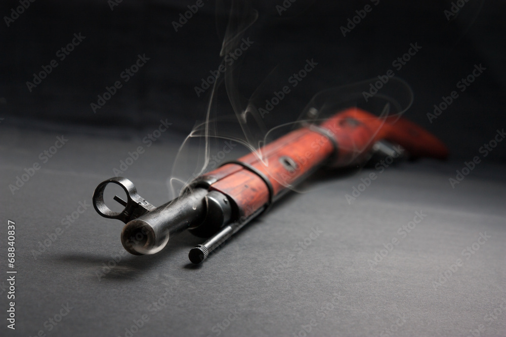 old army rifle with smoke old army rifle with smoke