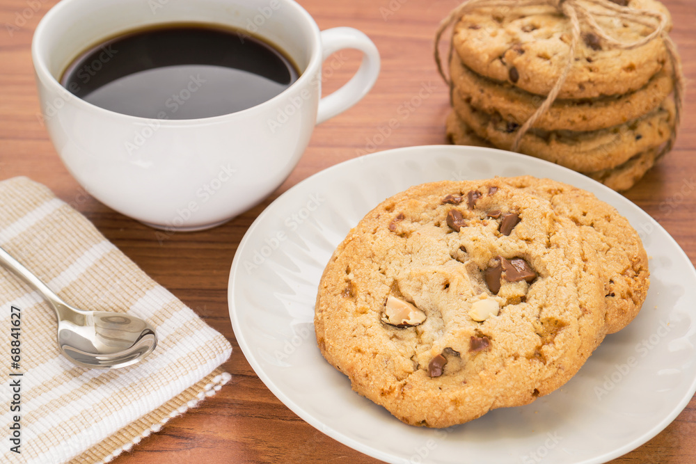 Chocolate chip cookie with almond and coffee cup Chocolate chip cookie with almond and coffee cup