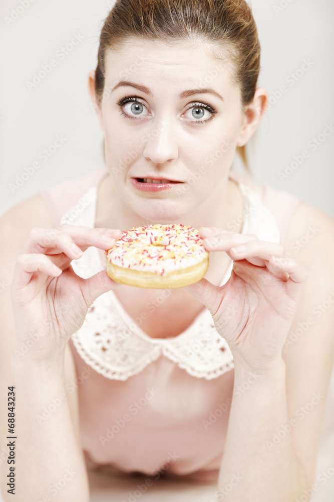 Woman eating a doughnut