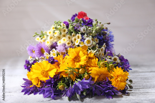 Wallpaper Mural Beautiful wild flowers on wooden table Torontodigital.ca