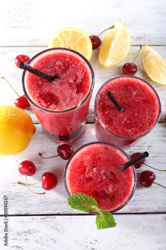 Fresh cold cherry cocktail with mint and lemon