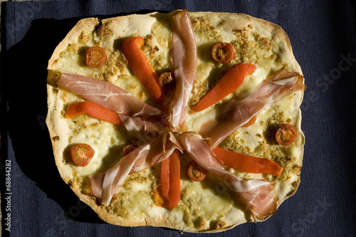 Pizza with tomatoes, pepper, ham top view