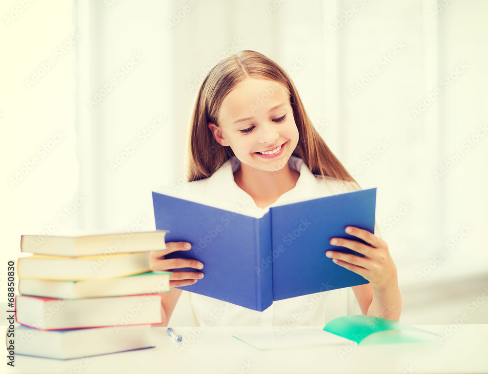 girl studying and reading book at school girl studying and reading book at school