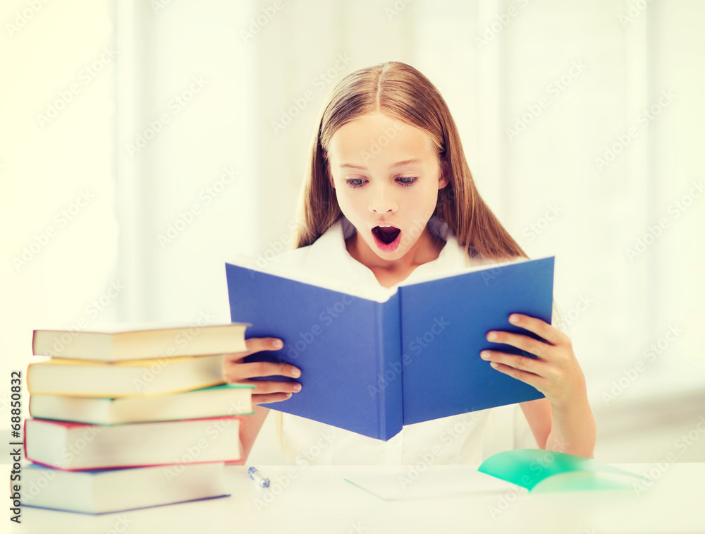 girl studying and reading book at school girl studying and reading book at school