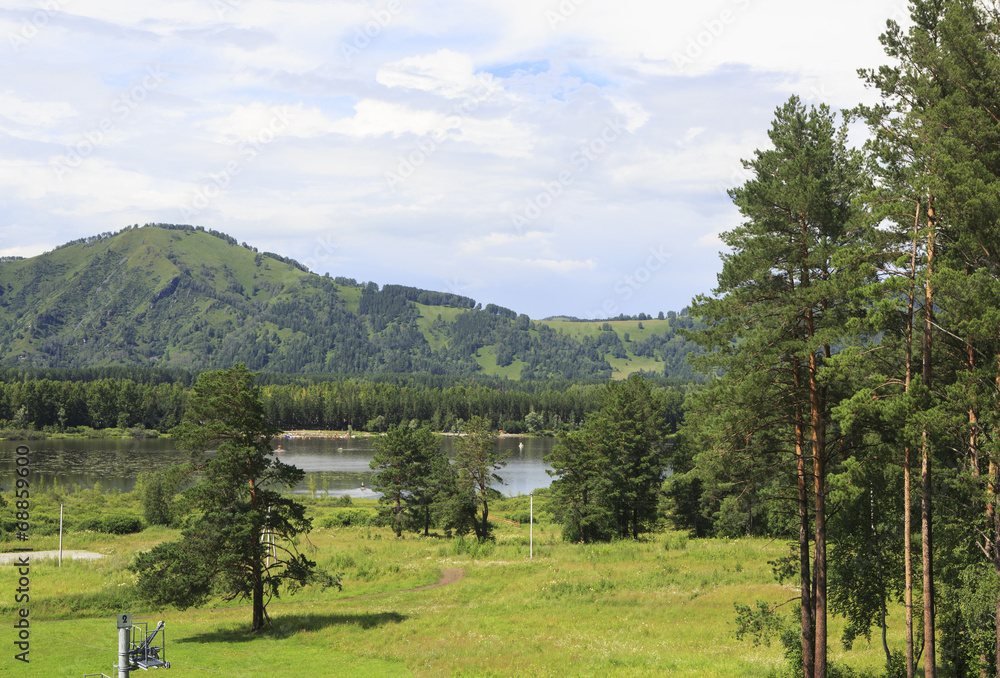 Mountains, pine trees and lake Manzherok.