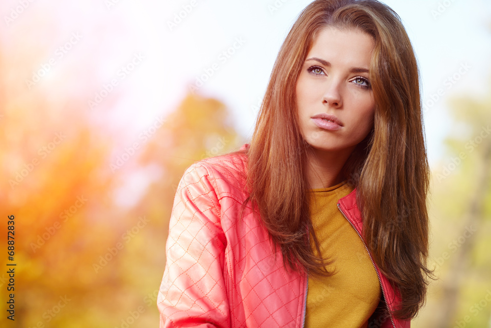 Fashion woman walking in autumn park Fashion woman walking in autumn park