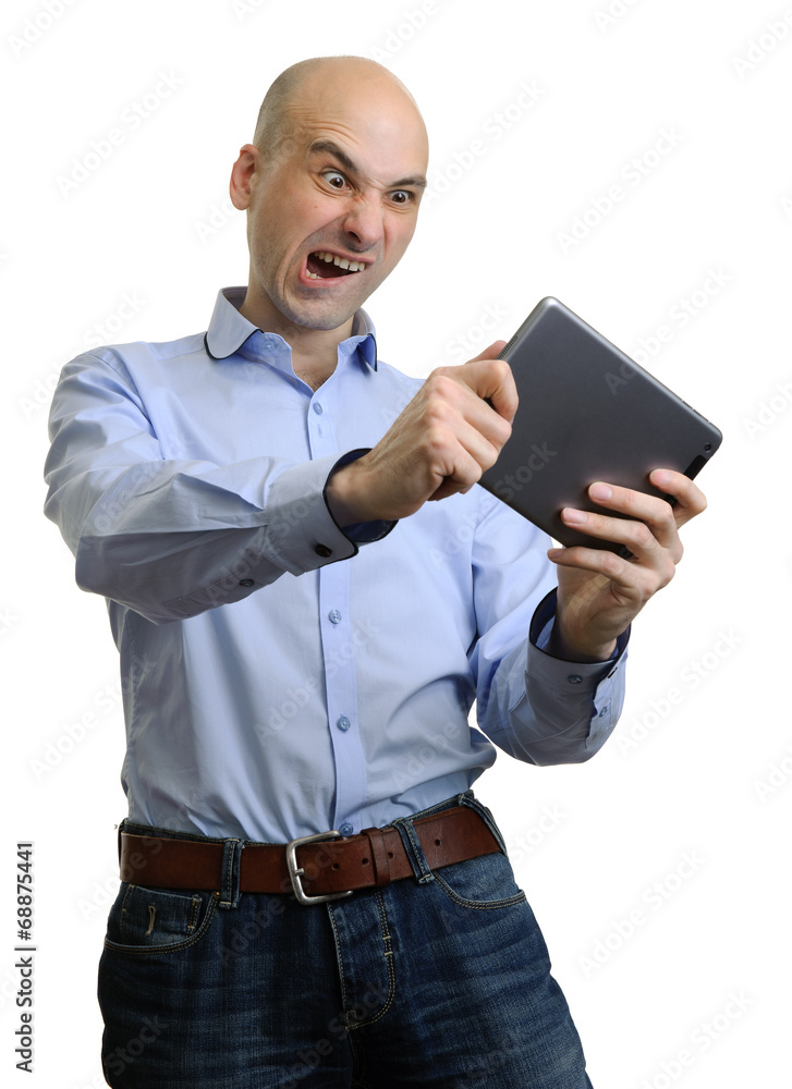 young man playing games on his tablet young man playing games on his tablet