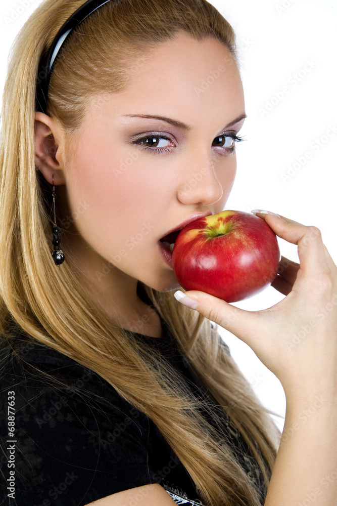 Attractive woman eating an apple , promoting healthy lifestyle Attractive woman eating an apple , promoting healthy lifestyle