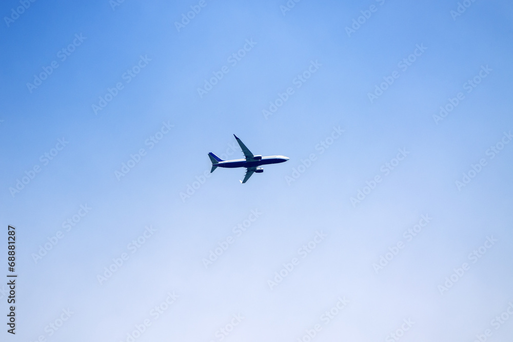 Airplane over clear blue sky Airplane over clear blue sky