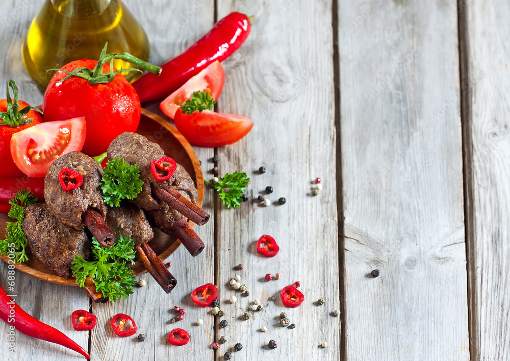 Kebab on cinnamon sticks background Kebab on cinnamon sticks background