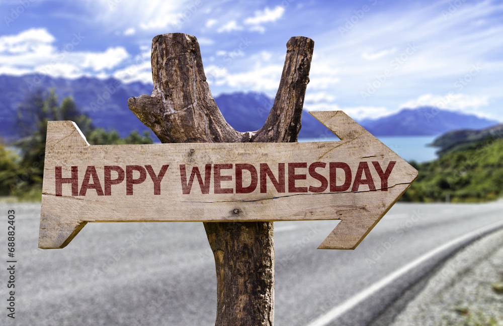 Happy Wednesday wooden sign with a street background