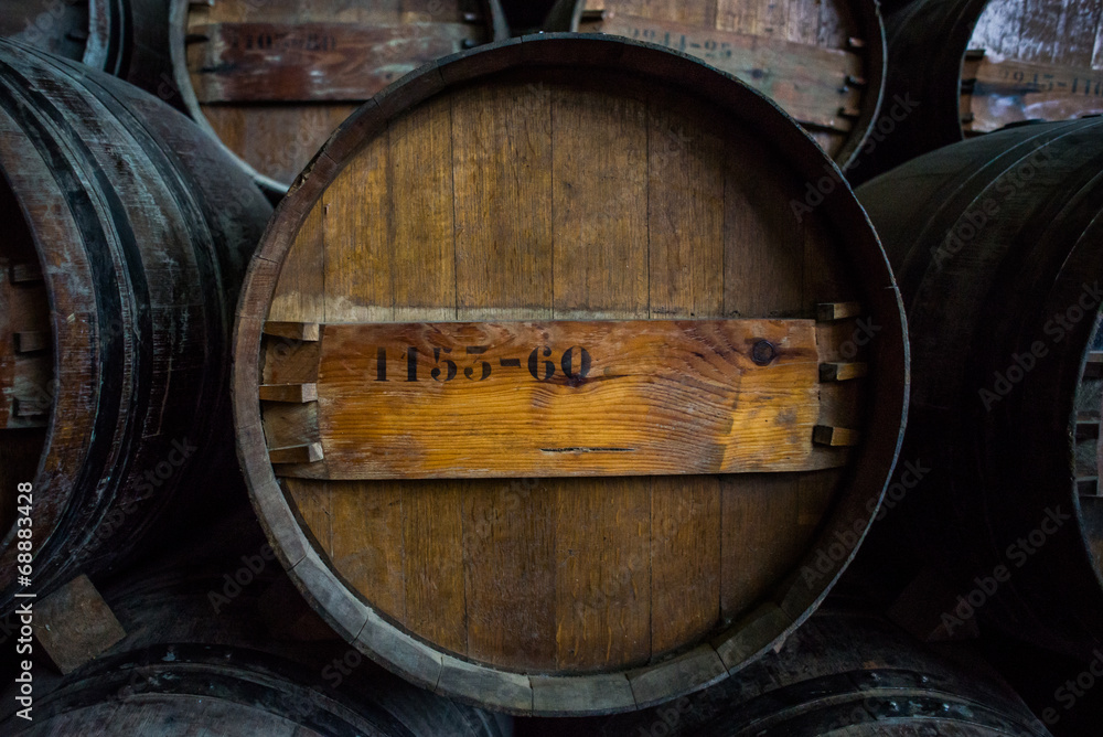 Wine barrels stacked in the cellar of the Quinta da Bacalhoa win Wine barrels stacked in the cellar of the Quinta da Bacalhoa win