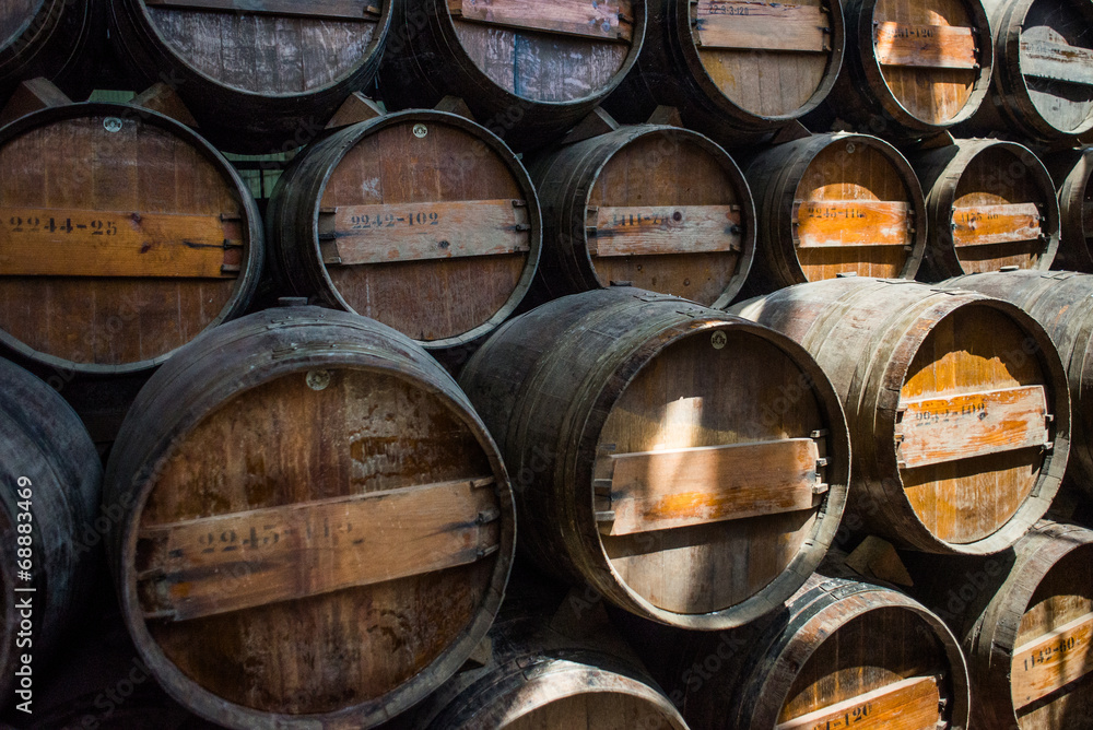 Wine barrels stacked in the cellar of the Quinta da Bacalhoa win
