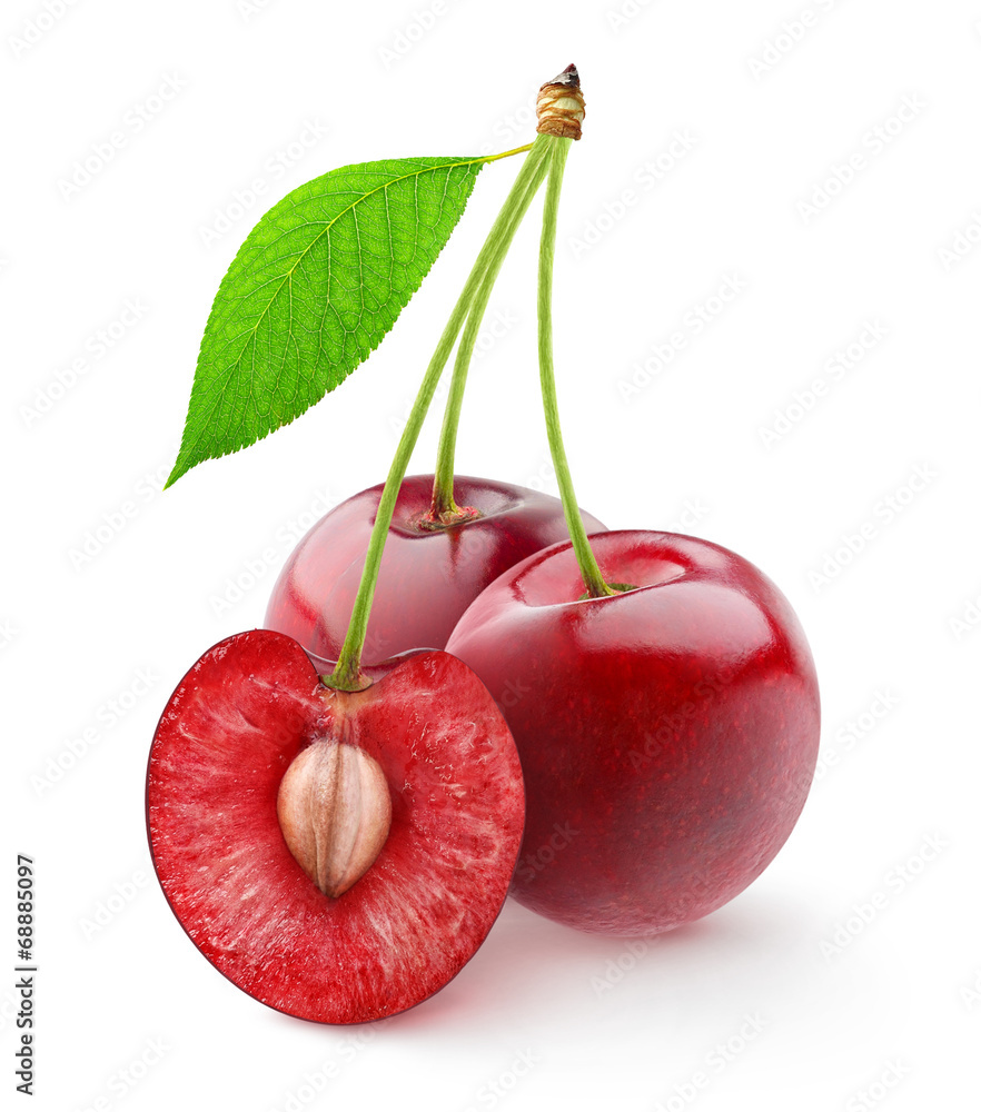Isolated cherries. Three sweet cherry fruits, one cut in half, with