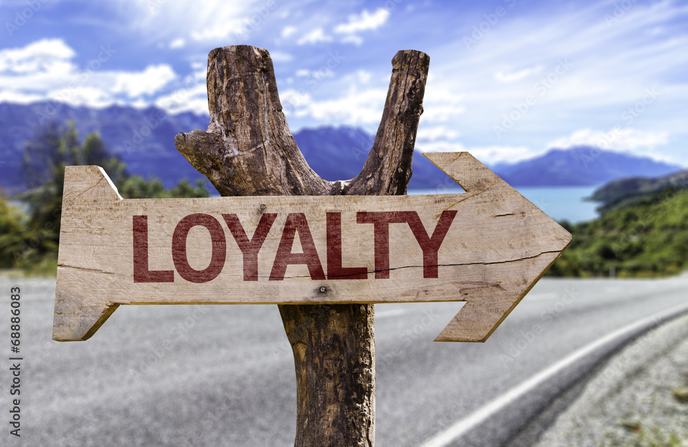Loyalty wooden sign with a street background