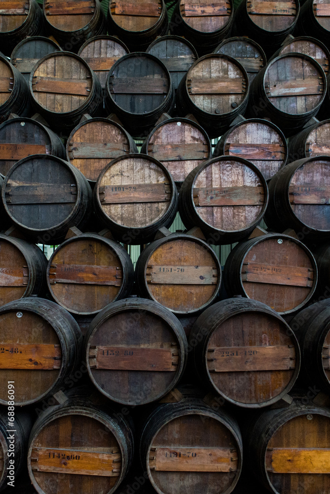 Wine barrels stacked in the cellar of the Quinta da Bacalhoa 