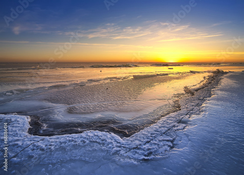 Sunset in the ice land. Beautiful winter landscape