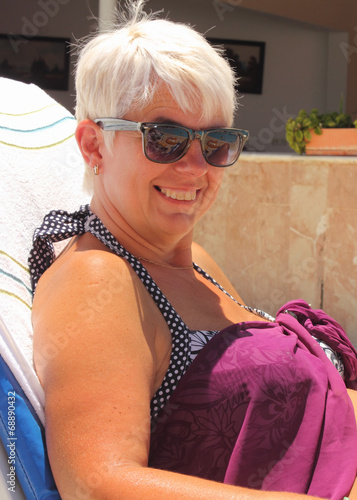 Fotografie An english lady relaxing while on holiday