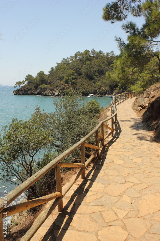 A pathway with fencing along the coast at katranci bay, Turkey