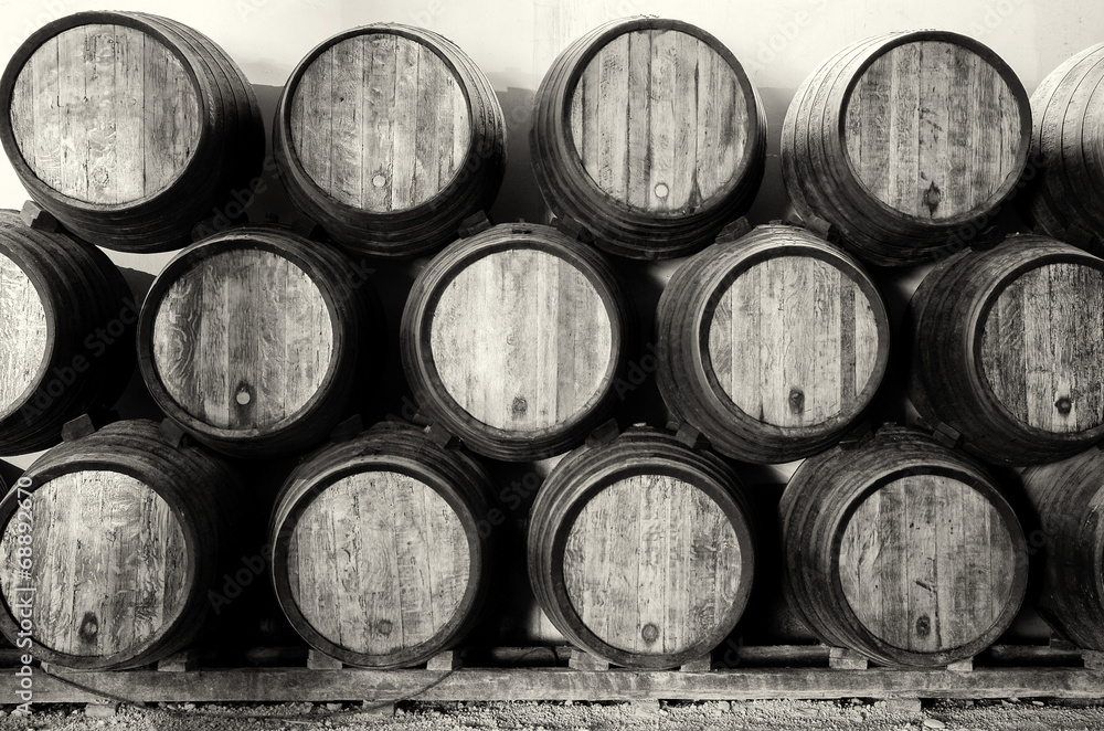 Fotografie, Obraz Whisky or wine barrels in black and white
