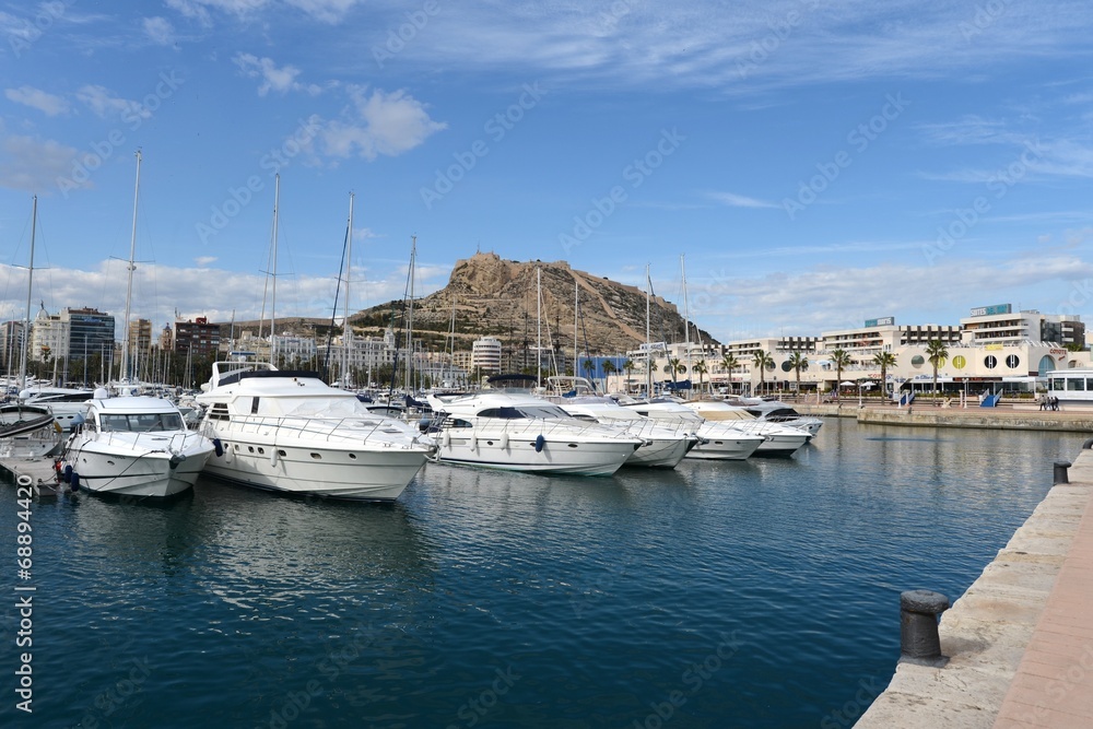 View of Alicante with yachts at sea.