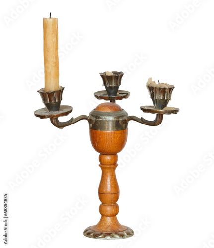 triple candlesholder with one candle isolated