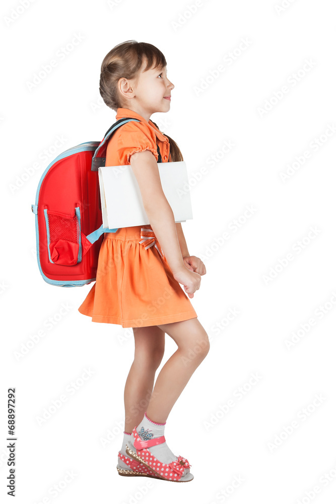 Cute schoolgirl goes with red backpack on her shoulders Cute schoolgirl goes with red backpack on her shoulders