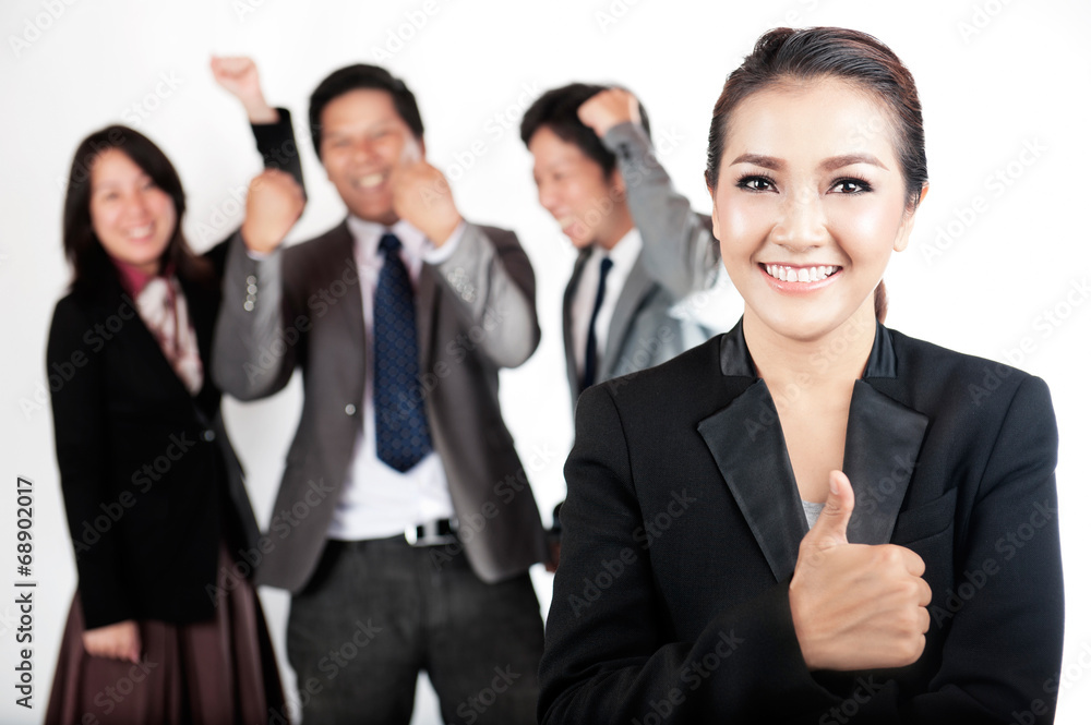 Happy team of workers giving thumps up Happy team of workers giving thumps up