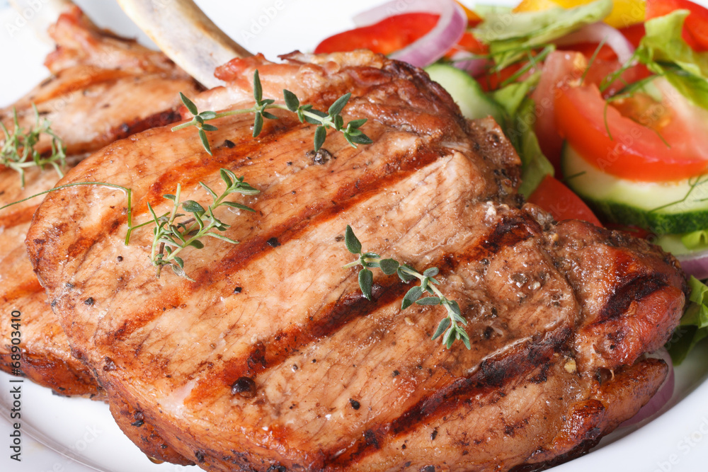 Grilled pork macro and salad with fresh vegetables Grilled pork macro and salad with fresh vegetables