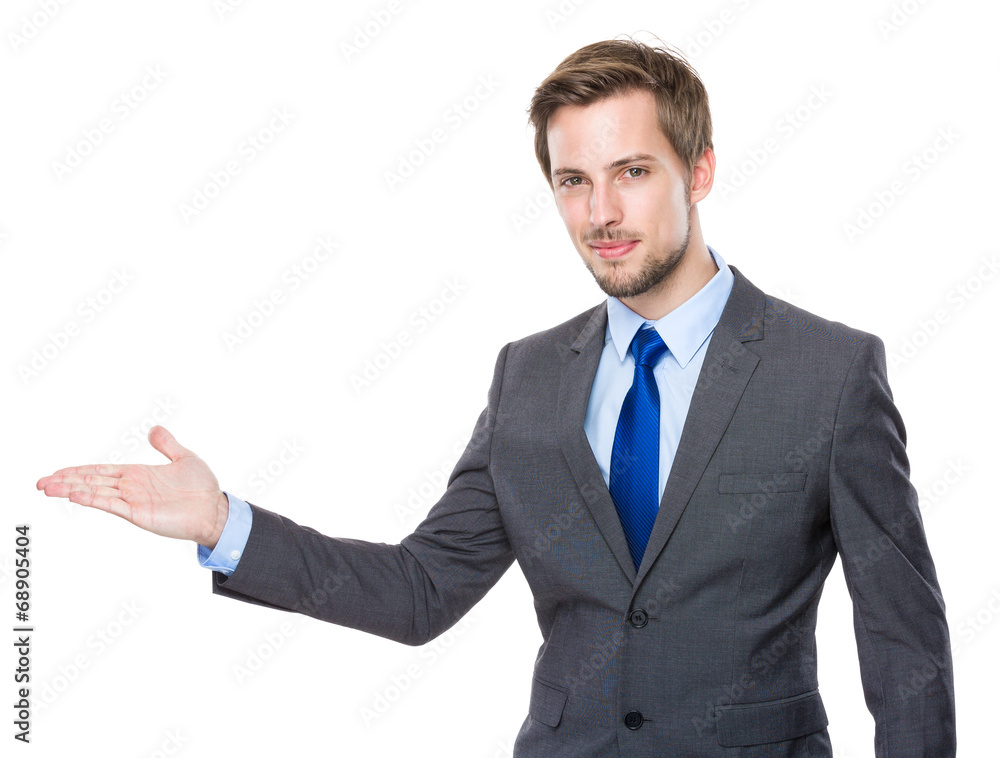 Caucasian businessman with hand presentation Caucasian businessman with hand presentation