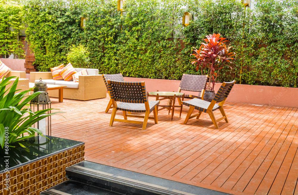 Obraz premium Tableset on terrace, tree frence background.