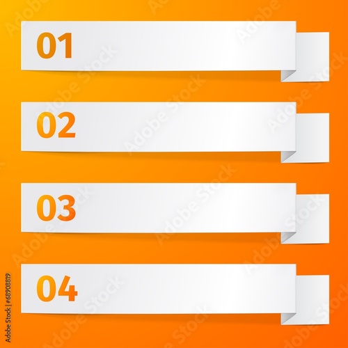 White sheets of paper on a orange background.