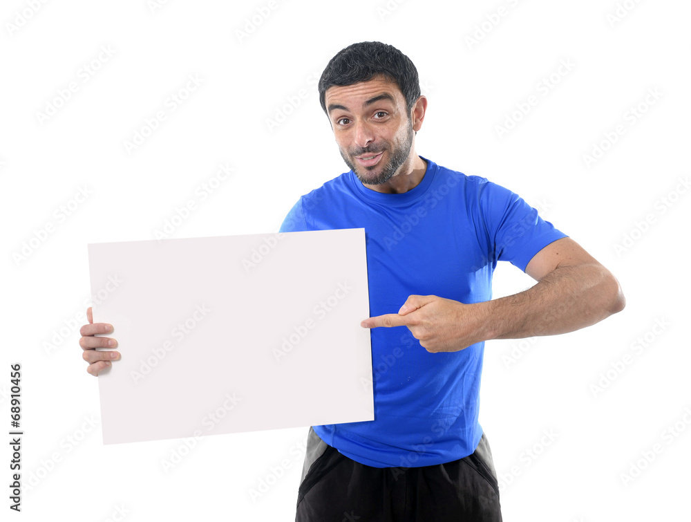 young attractive sport man holding blank billboard as copy space young attractive sport man holding blank billboard as copy space