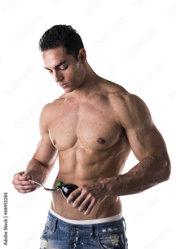 Strong muscular man taking medication Strong muscular man taking medication