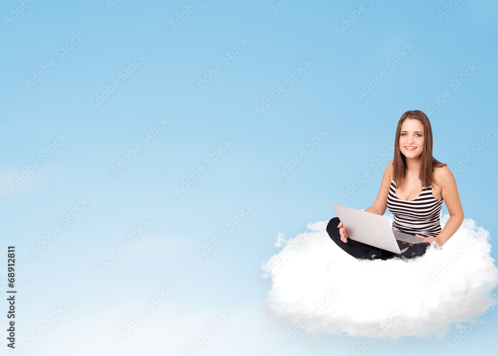 Young woman with laptop sitting on cloud with copy space