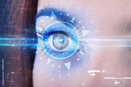 Cyber girl with technolgy eye looking into blue iris