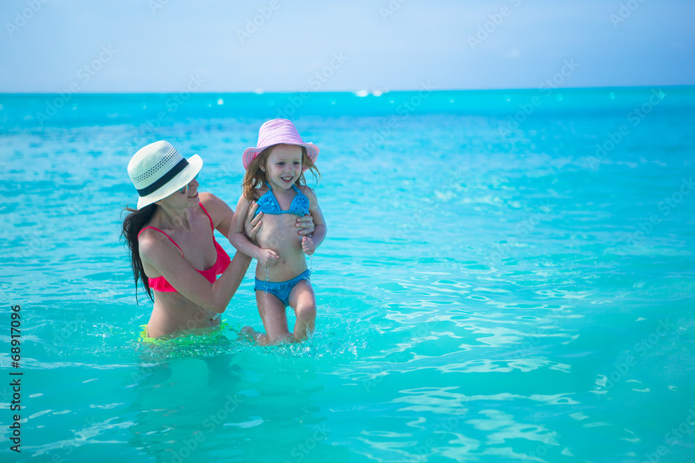 Mother with her little kid have fun on summer vacation