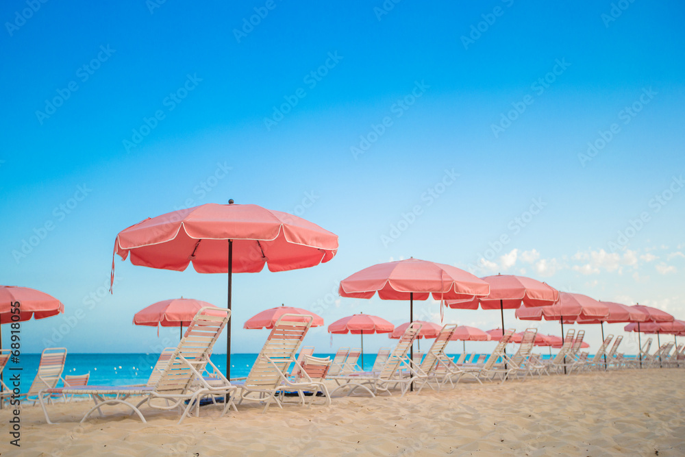 Paradise view of tropical empty plage with umbrella and beach