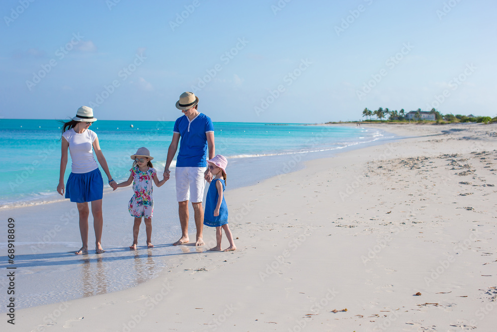 Happy family with two girls on summer vacation