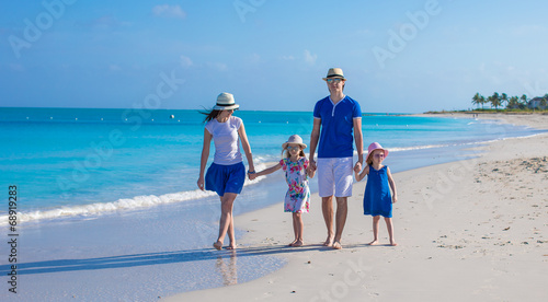 Family of four on beach vacation © travnikovstudio
