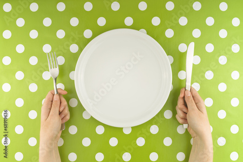 Hands at the table with empty set photo