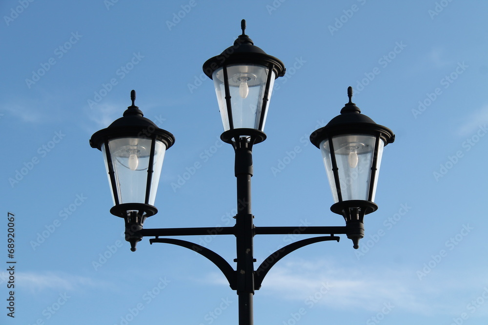 A Stand of Three Vintage Style Street Lamps.
